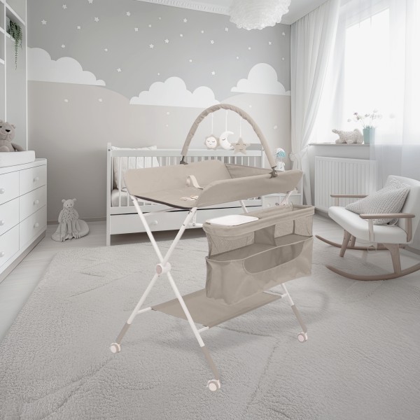 Masă de Înfășat Multifuncțională Moni Kaskada Beige, 5 Poziții Înălțime, Arc Jucării Detașabil, Organizator, 4 Roți cu Frâne, 0-15 kg